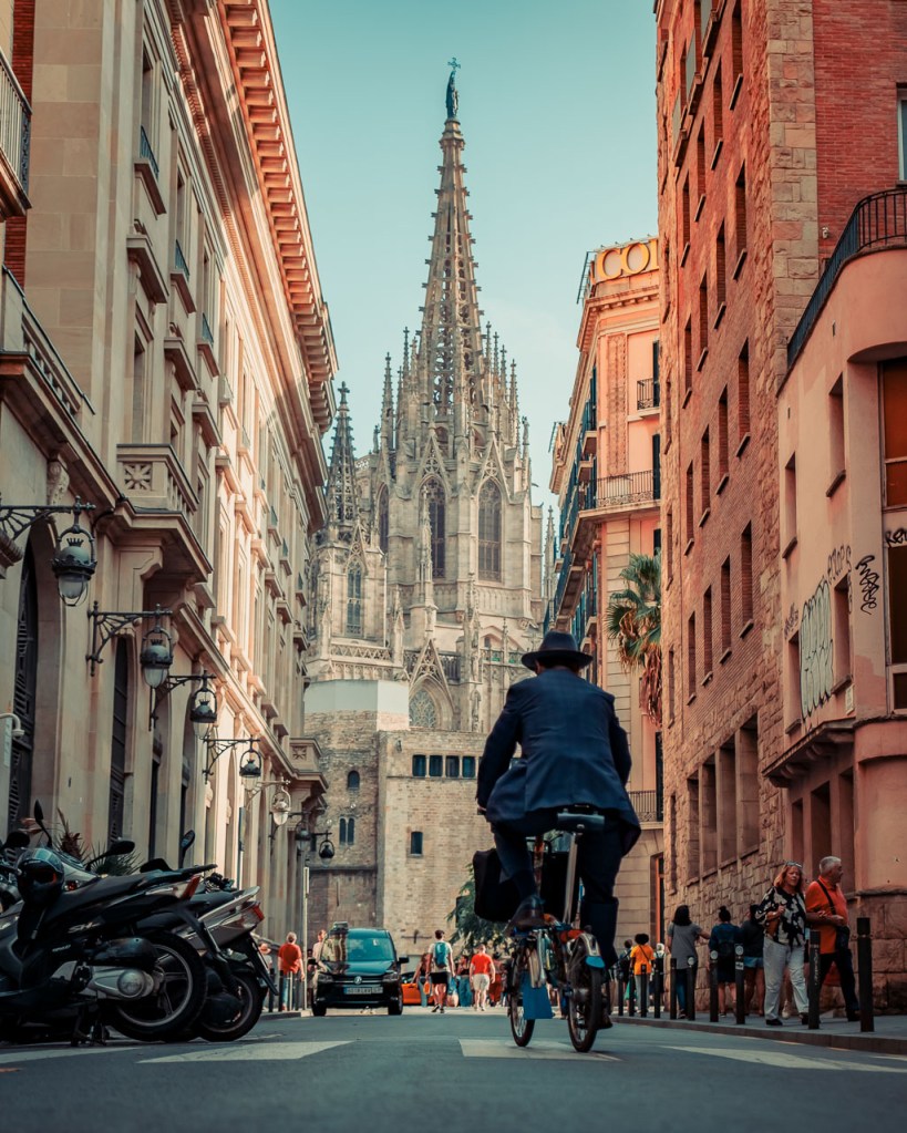 A man riding a bicycle in Barcelona, Spain